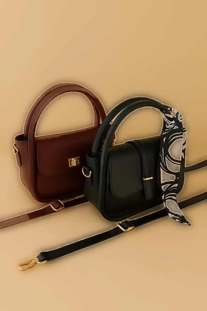 ست کیف زنانه دو عددی شامل کیف دستی و کیف دوشی با جزئیات اکسسوری طلایی و اهدای شال، به رنگ سرمه‌ای و قرمز، برند MonaMilan - 5039