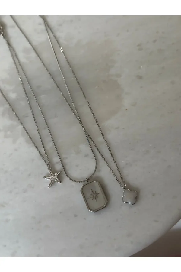 ست گردنبند سه‌گانه از جنس فولاد ضد زنگ 316L با روکش رودیوم، شامل طرح مدل شبدر و ستاره دریایی - 7642