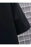 تی‌شرت مشکی کوتاه‌مُد با یقه گرد و آستین کوتاه طرح‌دار از برند کوبو (Unisex Oversize) پنبه‌ای - 8551