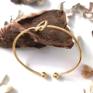 دستبند براق زنانه با حلقه گره‌ای طلایی - 12064