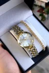 ساعت مچی زنانه با بند از جنس استیل ضد زنگ به رنگ طلایی، با هدیه دستبند ۱۰۰% اورجینال - 12145